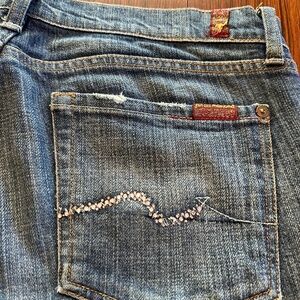 Swarovski crystal, bootcut jeans.